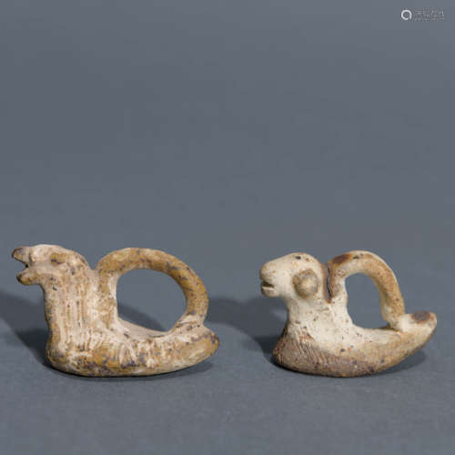 Two Carved Pottery Ornament