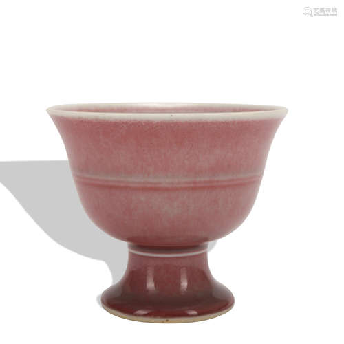 A red glazed cup