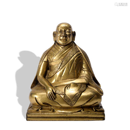 A gilt-bronze statue of Guru