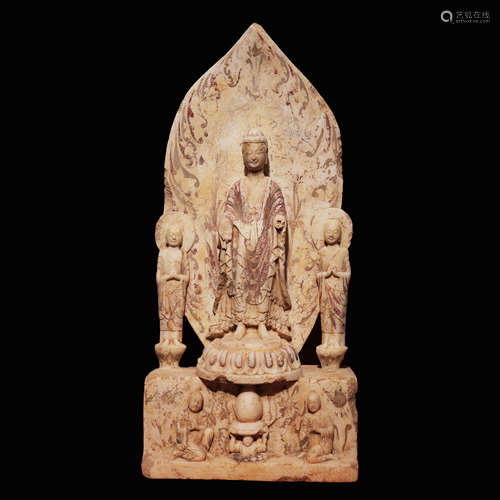 China's Northern Wei Dynasty
Three Buddha statues with white...