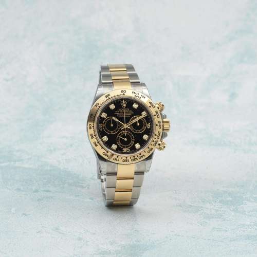 ROLEX. A FINE 18K GOLD AND STAINLESS STEEL AUTOMATIC CHRONOG...