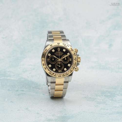 ROLEX. A FINE 18K GOLD AND STAINLESS STEEL AUTOMATIC CHRONOG...