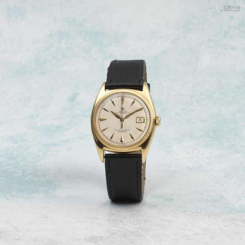 Rolex. An 18K gold automatic bubble back wristwatch with red...
