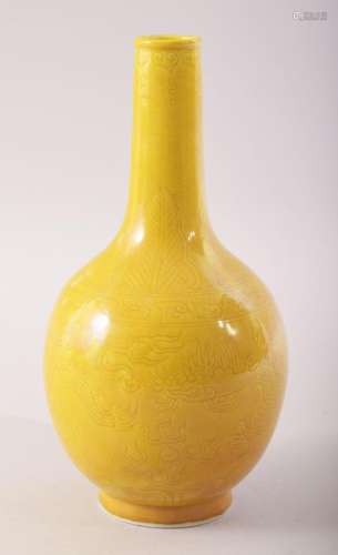 A SMALL CHINESE YELLOW GLAZE PORCELAIN BOTTLE VASE, incised ...