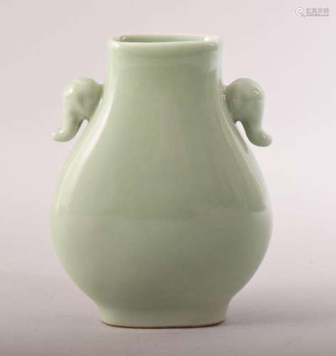 A SMALL CHINESE CELADON GLAZED VASE, with elephant formed ha...