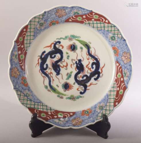 A LARGE JAPANESE PORCELAIN DISH AND STAND, decorated in the ...
