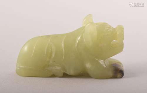 A SMALL CHINESE CARVED JADE FIGURE OF A BEAST, 6cm long.
