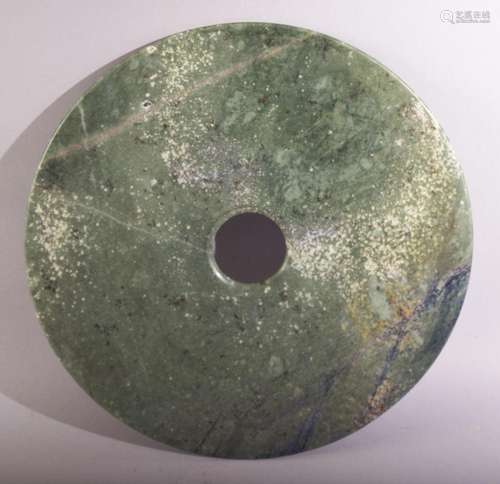 A GOOD LARGE CHINESE HARDSTONE BI DISK, 30cm diameter.