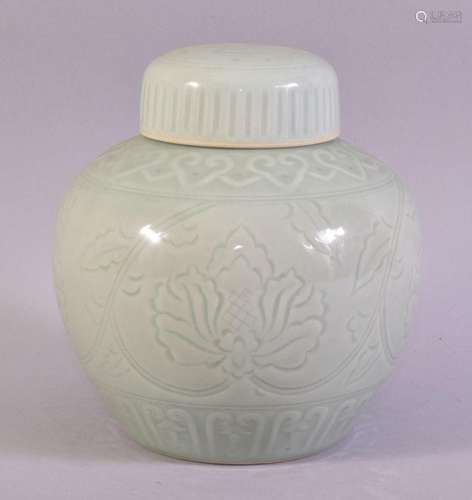 A GOOD CHINESE CELADON PORCELAIN JAR AND COVER, with incised...