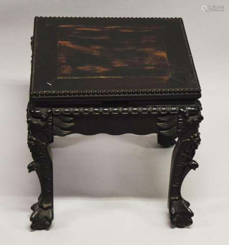 A SMALL CHINESE SQUARE FORM HARDWOOD TABLE, with carved flor...