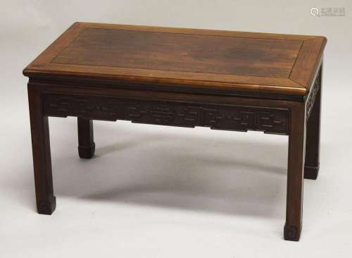 A CHINESE HARDWOOD RECTANGULAR TABLE, with carved frieze and...