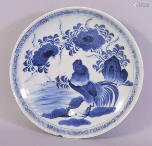 A CHINESE BLUE AND WHITE PORCELAIN DISH, painted with rooste...