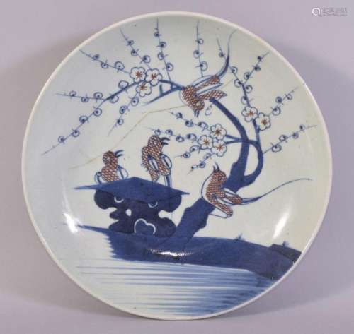 A CHINESE BLUE, WHITE AND IRON RED PORCELAIN DISH, the centr...