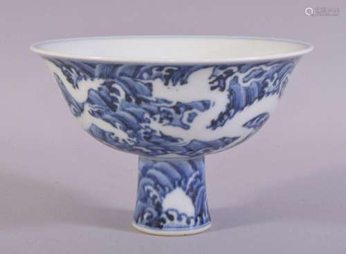 A CHINESE BLUE AND WHITE PORCELAIN STEM CUP, the exterior of...