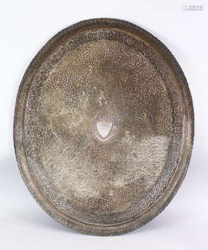 A LARGE INDIAN SILVERED BRONZE OR BRASS TRAY, with a central...