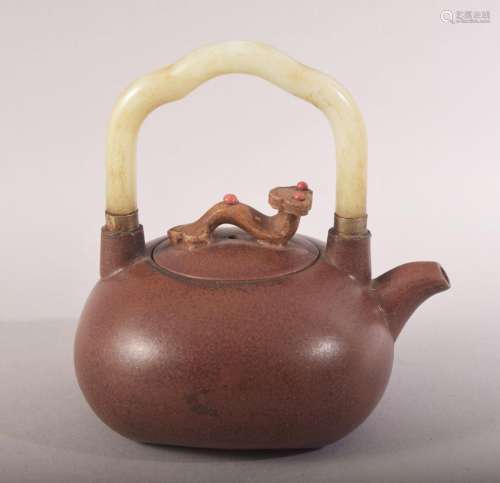 A CHINESE YIXING CLAY JADE HANDLE TEAPOT - the handle with a...