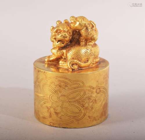 A CHINESE GILT BRONZE LION DOG SEAL - the top with two lion ...