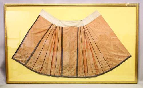 A 19TH CENTURY PALE RED SKIRT, with gold thread embroidered ...