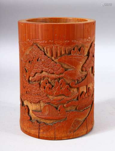 A CHINESE BAMBOO BRUSH POT, carved with a landscape scene an...