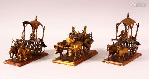 THREE 19TH CENTURY INDIAN METAL MODELS OF CARTS, each cart d...