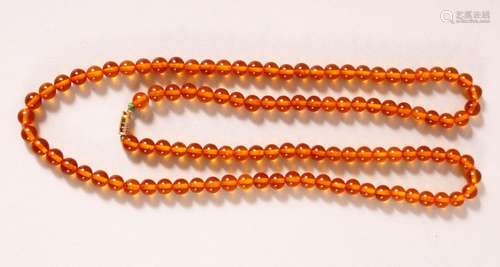 A CHINESE BEADED NECKLACE, possibly amber, each bead approx....