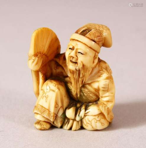 A JAPANESE MEIJI PERIOD CARVED IVORY NETSUKE - SEATED MAN - ...