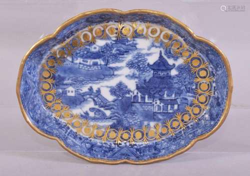 A CHINESE BLUE AND WHITE PORCELAIN TRAY, painted with a rive...