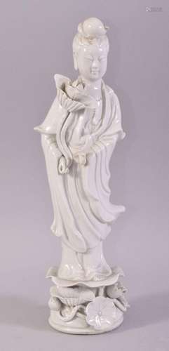 A CHINESE PORCELAIN BLANC DE CHINE FIGURE OF GUANYIN, stood ...