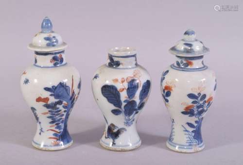 THREE SMALL IMARI PORCELAIN VASES with two covers, tallest 1...