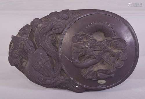 A GOOOD CHINESE CARVED INKSTONE, decorated with dragon and p...