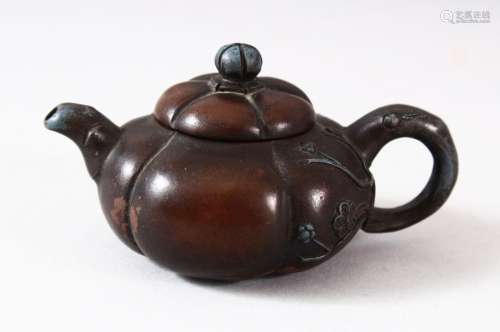 A CHINESE YIXING FLUTED TEAPOT AND COVER, the inner cover wi...