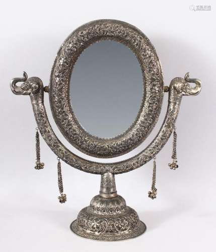 A GOOD INDIAN EMBOSSED WHITE METAL MIRROR ON STAND - the mir...