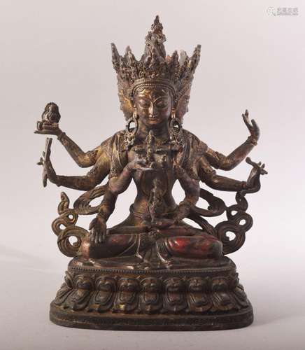 A TIBETAN GILT BRONZE FIGURE OF A MULTI ARM DEITY / BUDDHA -...