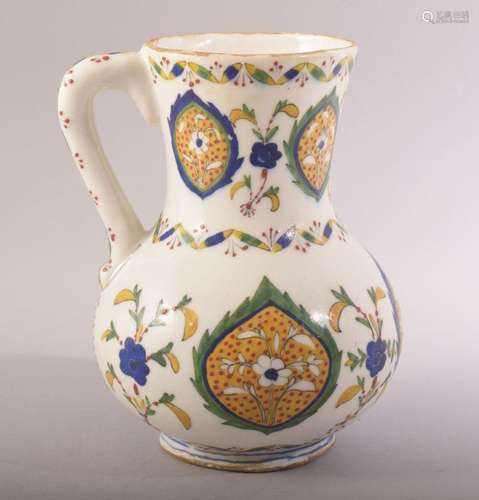 A TURKISH OTTOMAN GLAZED POTTERY KUTAHYA JUG, decorated with...