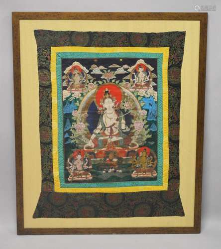 A GOOD LARGE 20TH CENTURY TIBETAN THANKA, mounted and framed...