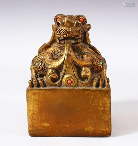 A CHINESE GILT BRONZE SEAL OF A DRAGON - inlaid with simulat...