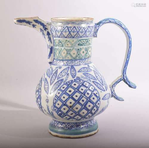 A TURKISH KUTAHYA GLAZED POTTERY WATER JUG, painted with blu...