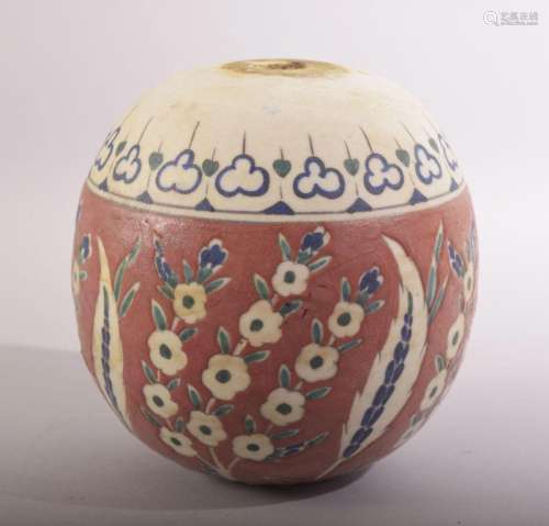 A TURKISH IZNIK POTTERY MOSQUE BALL, decorated with stylised...