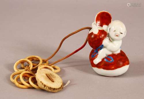 A 19TH CENTURY JAPANESE MEIJI PERIOD PORCELAIN NETSUKE OF A ...