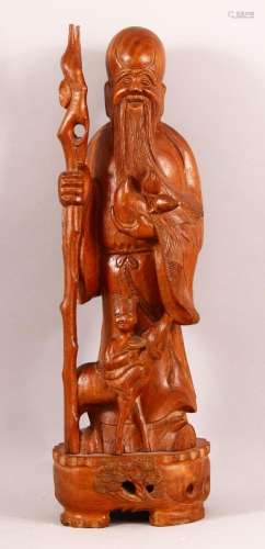 A CHINESE CARVED HARDWOOD FIGURE OF SHOU LAO - 47cm high