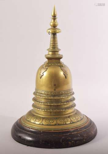 A RARE INDIAN BRASS STUPA, fitted to a wooden stand, 28cm hi...
