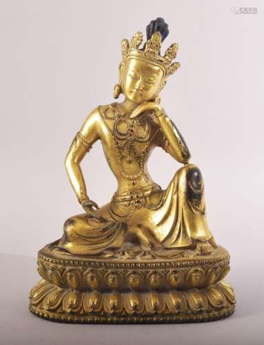 A FINE CHINESE OR TIBETAN GILT BRONZE BUDDHA, seated in a co...