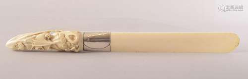 A CARVED IVORY LETTER OPENER, the handle carved with bats, t...