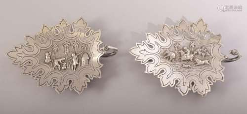 TWO INDIAN KUTCH SILVER LEAF FORM DISHES, the centre of each...