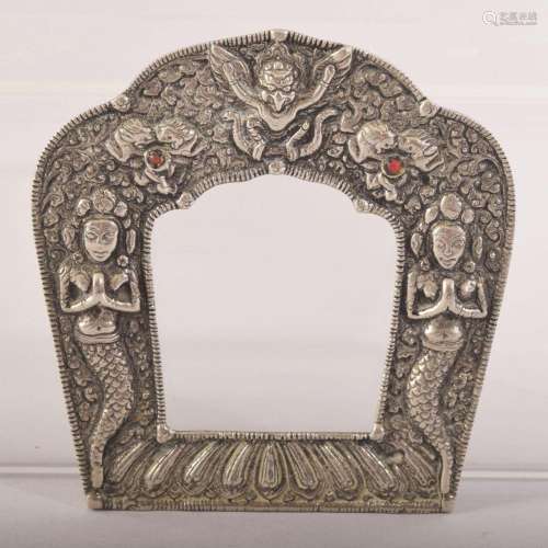 AN INDIAN OR NEPALESE WHITE METAL FRAME, 11.5cm x 11cm.