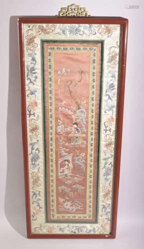 A 19TH CENTURY CHINESE EMBROIDERED SILK PANEL, framed and gl...