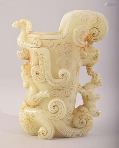 A LARGE CHINESE CARVED PALE GREEN HARDSTONE CUP, the body ca...