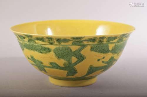 A CHINESE YELLOW GROUND PORCELAIN BOWL, with incised and gre...