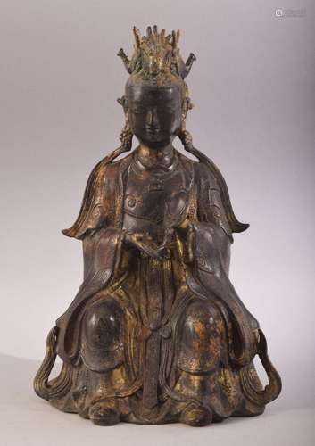 A GOOD CHINESE SEATED BRONZE FIGURE, with traces of gilt and...