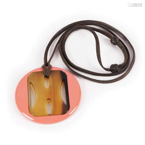 An Hermès lacquer and horn pendant
